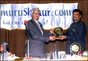 Director K. Shankara Rao honouring Justice P. P. Ramakrishnam Raju